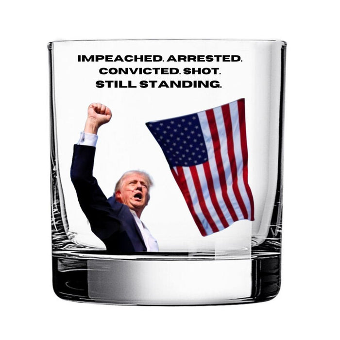 Impeached. Arrested. Convicted. Shot. Still Standing Rocks Glass