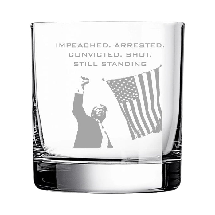 Impeached. Arrested. Convicted. Shot. Still Standing Rocks Glass